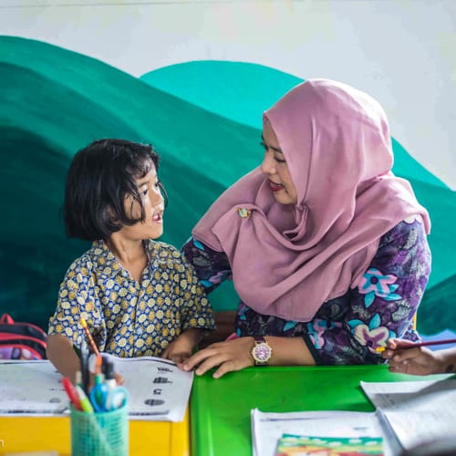 Teacher and student at Pre Grade 1 class