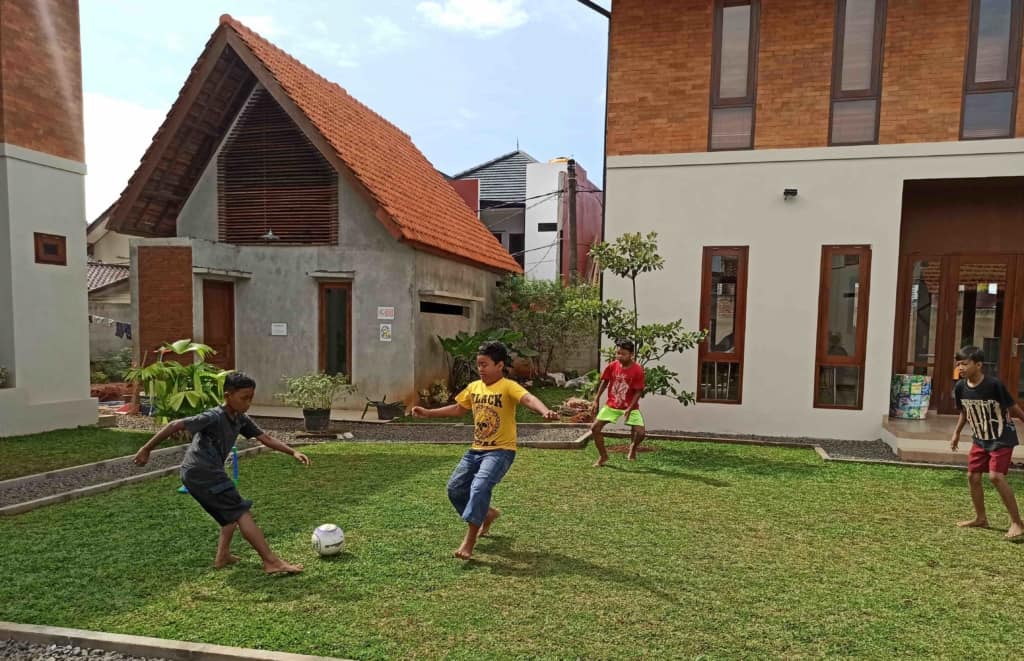 The boys playing soccer