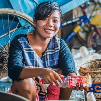 Woman sorting trash for XSProject